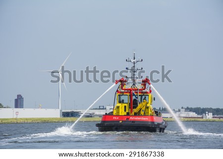 Port of Amsterdam, Noord-Holland/Netherlands - June 25-06-2015 - PA4 is using his water canons at the noordzeekanaal. PA4 (Port of Amsterdam 4) also known as the port authorities. (Photo nr. 2)