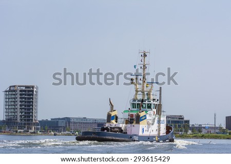 Port of Amsterdam, Noord-Holland/Netherlands - July 05-07-2015 -Tugboat Hercules is sailing in port.