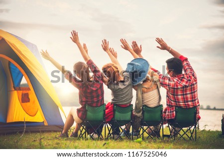 Group of Young Asian Camper Enjoy Camping Outdoors Party with Friends Near the Lake in the Forest -  Travel in Summer Holiday Concept