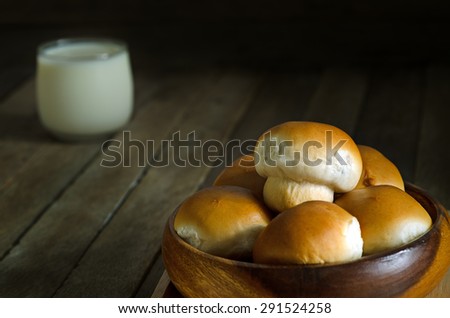 Still Life Warming Tone Dark Light Style of Mushroom Tuna Bread Recipe in Wooden Bowl and Milk Glass on Old Wood Table - Texture Background