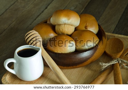 Still Life Light Style of Tuna Bread Recipe and Honey Cup in Wooden Plate on Old Wood Table - Texture Background