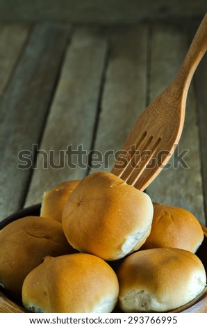 Still Life Style of Mini Bun Tuna Bread Recipe in Wooden Bowl on the Wooden Table - Texture Background