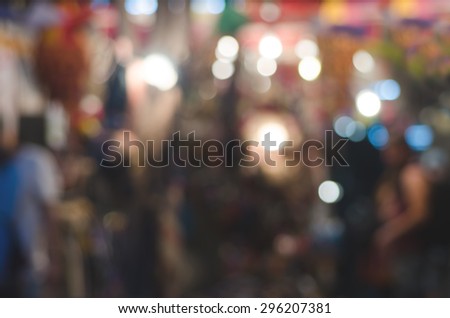 Abstract Blurred Style of More People Shopping in the Night Market - Urban Lifestyle Background