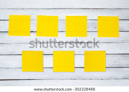 White Wood Planks with 7 Yellow Post It for Texture Background