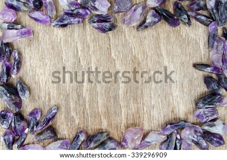 Amethyst Quartz Dog Teeth Rough Purple Crystal on Wooden Table Background for Texture