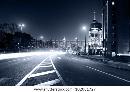 moving car with blur light through city at night in shanghai china