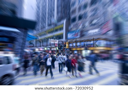 people rushing on the street in motion blur