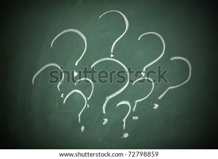 Question marks on a blackboard