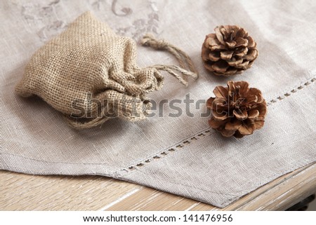 canvas bag for gifts and two cones  are on the table