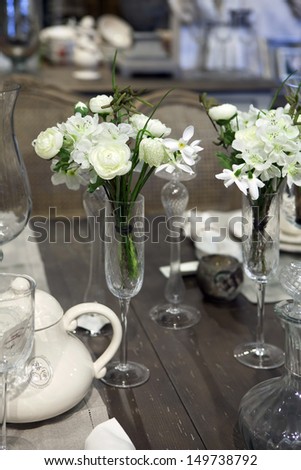 the dining table was decorated with the artificial  flower for the romantic time