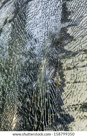 Broken glass-cracked windshield with hole
