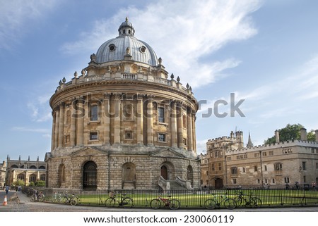 Oxford, UK - August 27, 2014: view of the Radcliffe Camera with All Souls College in Oxford, UK. The historic building is part of Oxford University Library.