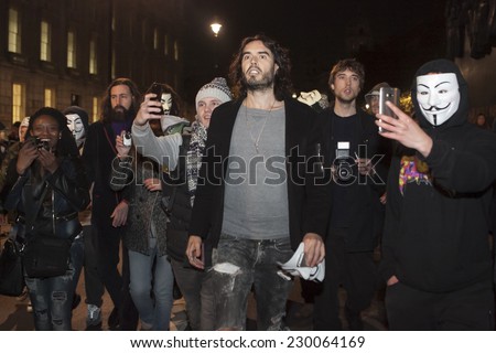London UK - NOVEMBER 5 2014: Anonymous & Stop Mass  Network held Million Mask March that started in Trafalgar square. Russell Brand joins March as violence breaks out between police and protesters