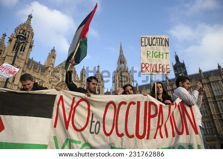 LONDON, ENGLAND - NOVEMBER 19: Students take part in a protest march against fees and cuts in the education system on November 19, 2014 in London, England.