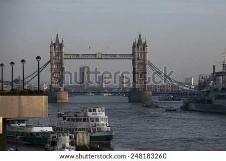 LONDON - OCTOBER 03: London Tower Bridge and HMS Belfast on October 03, 2014 in London, UK. London is one of the world\'s leading tourism destinations