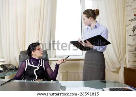 colleagues working in team. Office people. Boss give some instructions her secretary. Boss smoking