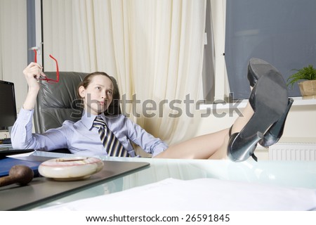 Big boss sitting on chair put her legs on table
