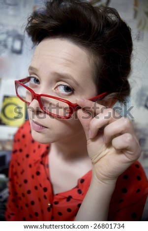 comic portrait of funny girl wearing vintage dress and comic glasses