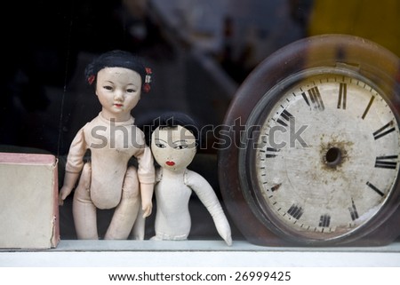 window with old dolls
