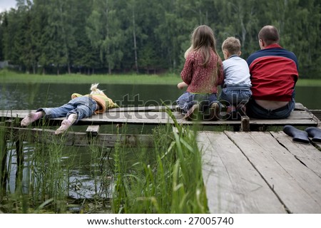 stock photo : fishing with dad. Three kids are fishing with dad