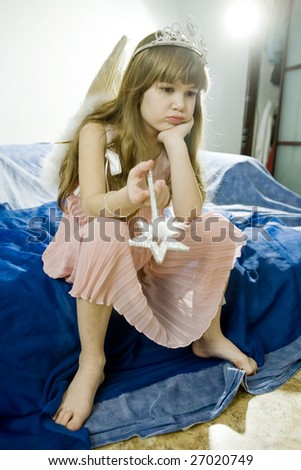 little upset girl playing in fairy tale