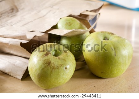 Apple  in parcel on the table. Organic food.  Sharpeness on apple
