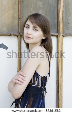portrait of depressed woman at window