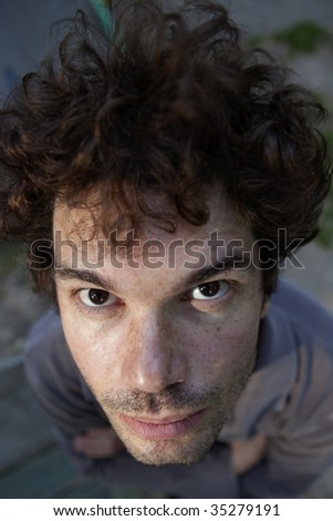 portrait of brunette serious man middle age  with freckles