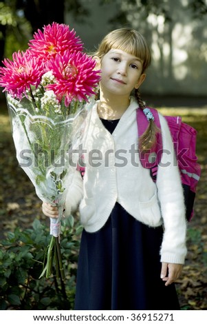 first time in first class. Girl with bouquet of dahlia