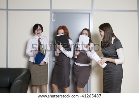 Business team over modern office background. Clerks waiting to give a report