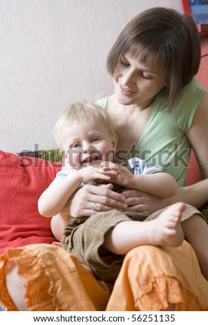 mother with her little son playing; indoor