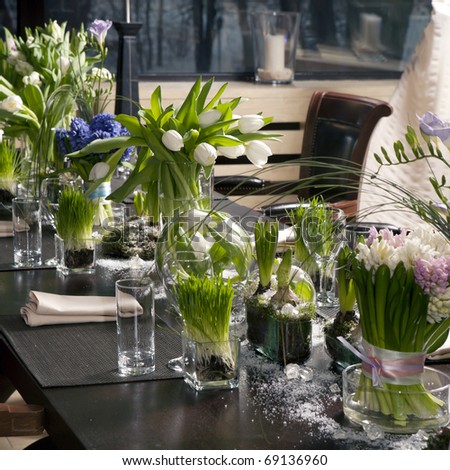 the dining table was decorated with the tulip  flower for the romantic time