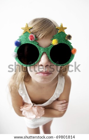 stock photo Little girl wearing big round glasses and making a silly