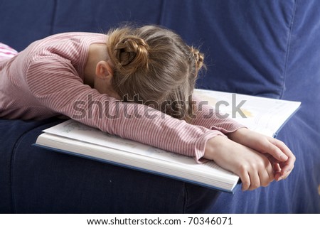 little tired girl sleep at book