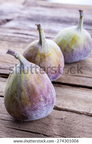 Figs whole shot on wood front on portrait