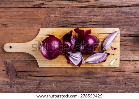 onions chopped on a chopping board shot from above on wood