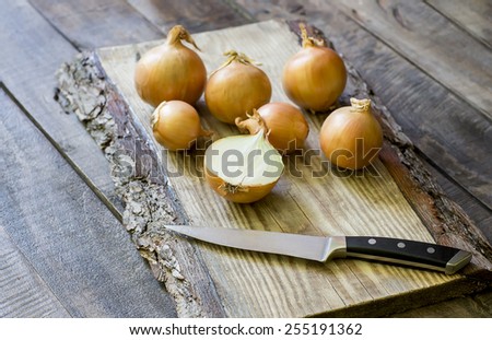 White Onion on brown vintage wood table