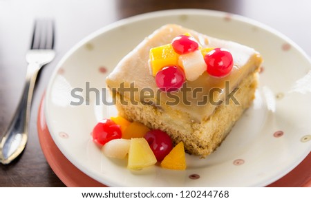 Fruit Cake dessert with real cherry,orange and peach. Very shallow depth of field.
