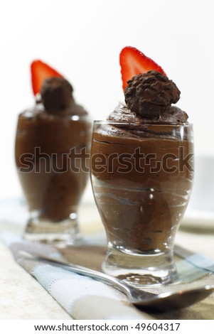Chocolate mousse made from dairy double cream with strawberry on the top. Shallow depth of field.