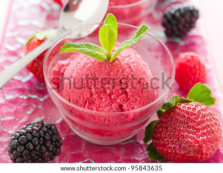 Fresh and healthy ice cream sorbet made with real fruit like strawberry and berry.Very shallow depth of field.