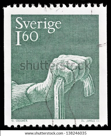 SWEDEN - CIRCA 1980: a stamp printed in the Sweden shows hand holding a cane, circa 1980.