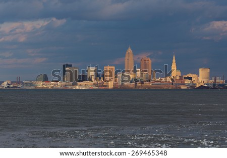 Wide shot of the central downtown area of Cleveland, Ohio. This shot was taken about 2 miles west of the city using the last light of day and as a late spring storm gathers behind the city.
