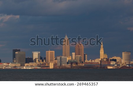 Wide shot of the central downtown area of Cleveland, Ohio. This shot was taken about 2 miles west of the city using the last light of day and as a late spring storm gathers behind the city.