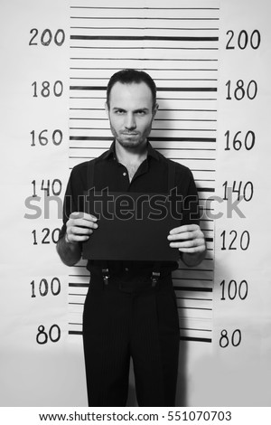 Portrait of criminal man on detective party