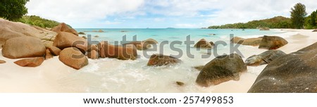 Landscape Panorama Seychelles lagoon with clean sand with stones and with a clear turquoise sea
