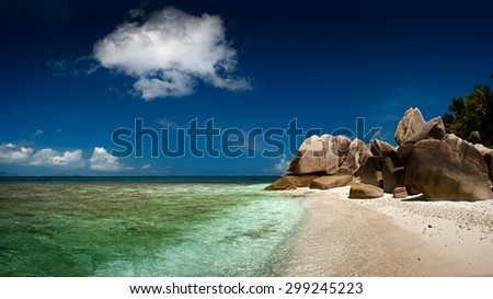 Seychelles lagoon with clean sand with stones and with a clear turquoise sea