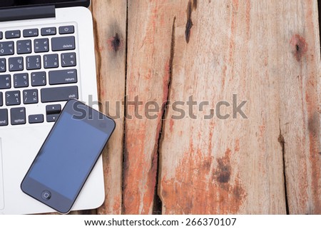 laptop and mobile phone on table