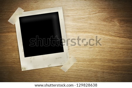 Old Polaroid Frames on wood background