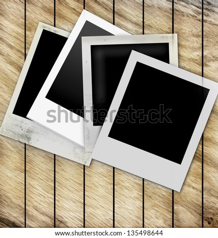 Old Polaroid Frames on wood background