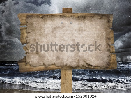 wood road sign on sea beach